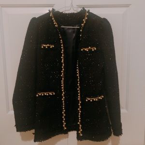 Chanel-style coat with pearls and chains